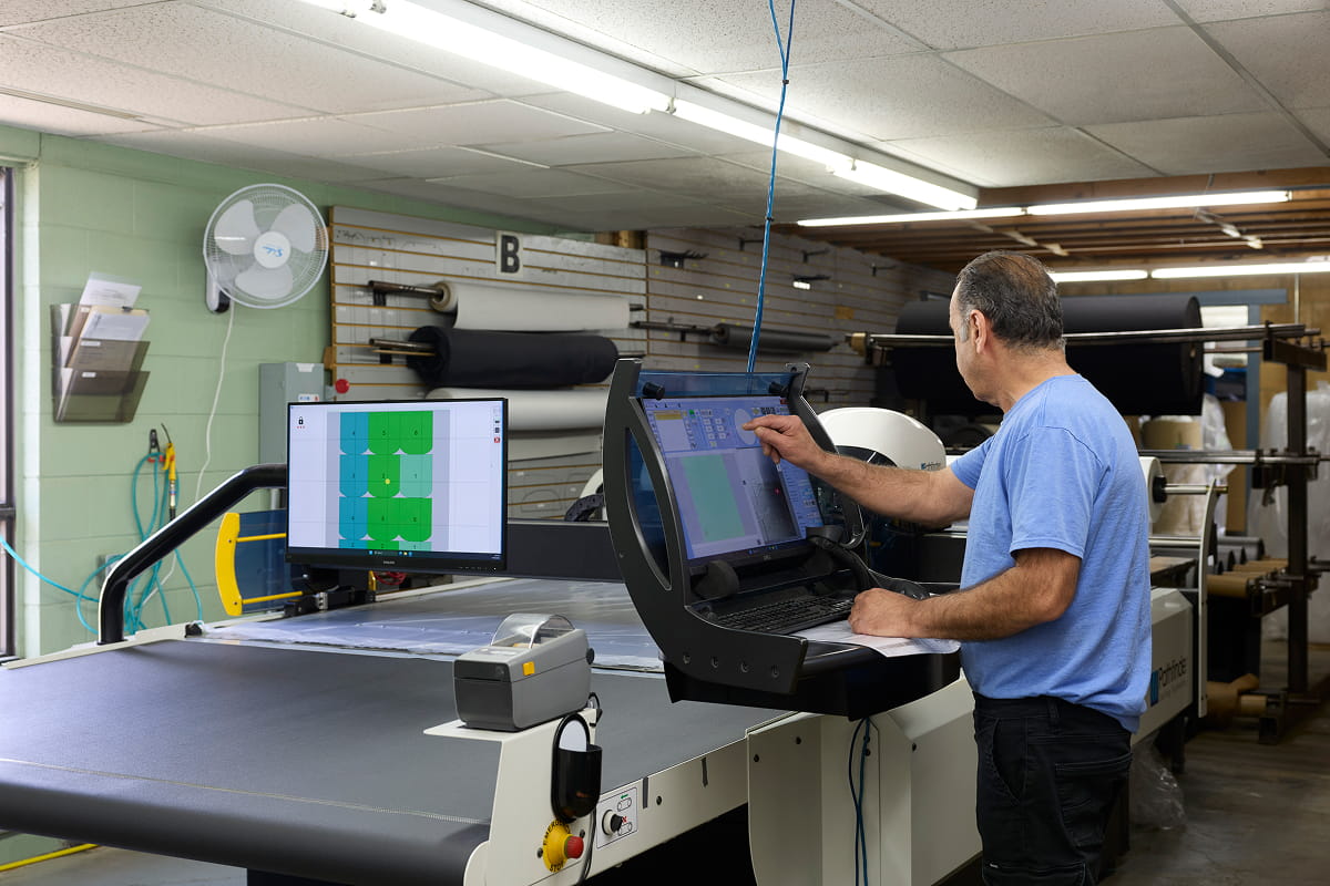 Automated CNC robotic fabric cutter processing heavy-duty materials