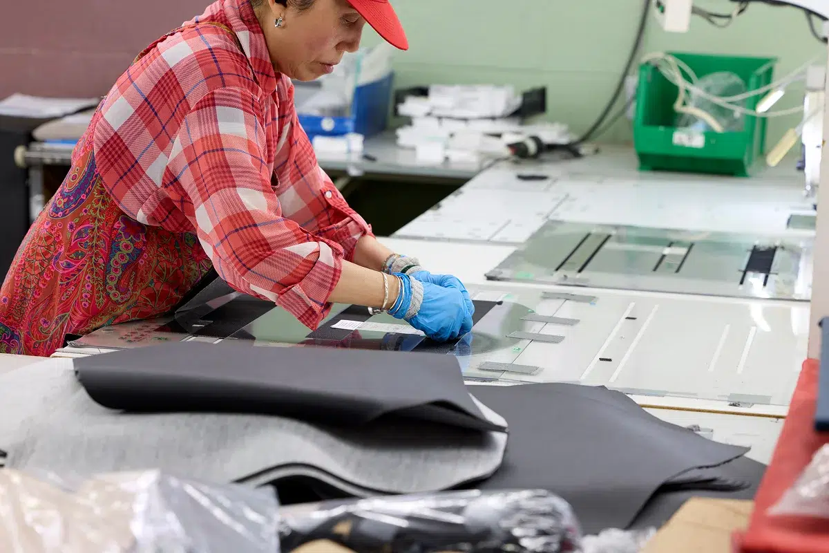 Contract cut and sew manufacturing line for high-volume client programs
